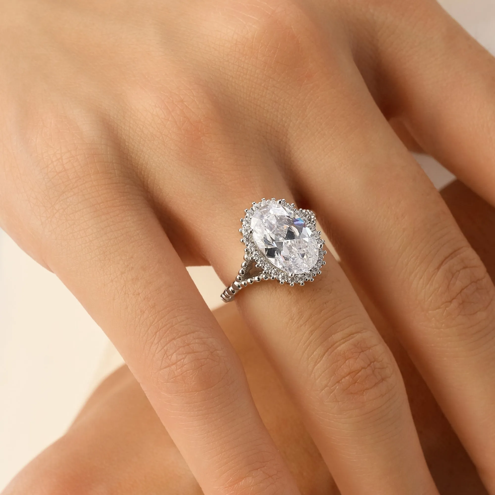 4 Carat TW Oval Cut Halo Engagement Ring