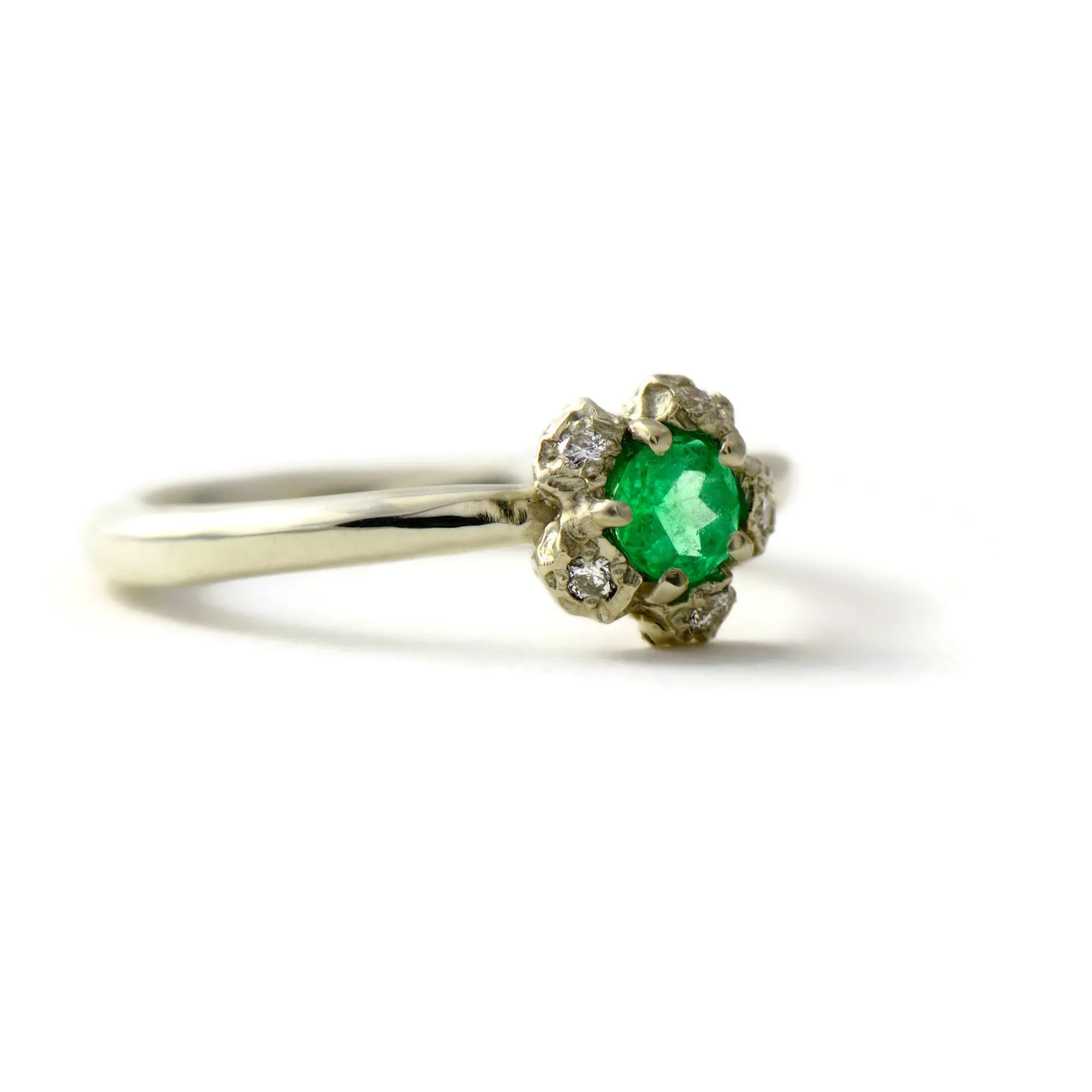 Natural Colombian emerald solitaire engagement ring  with a diamond cluster set in gold peppercorn