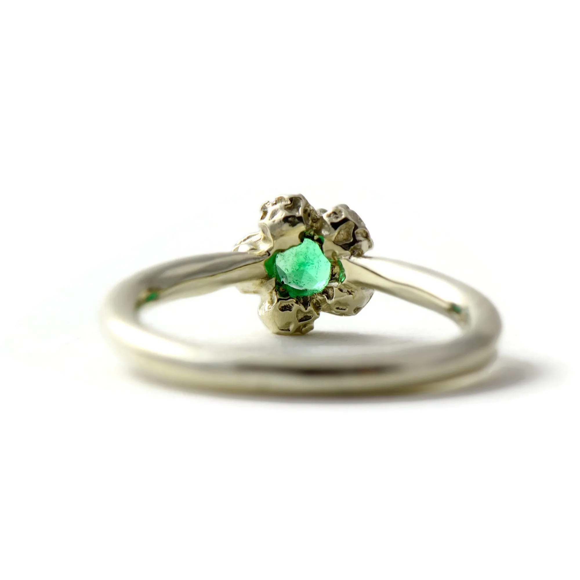 Natural Colombian emerald solitaire engagement ring  with a diamond cluster set in gold peppercorn