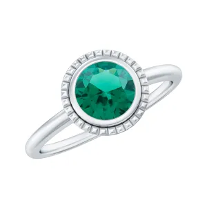 Round Lab-Created Emerald Solitaire Gold Ring in Bezel Setting