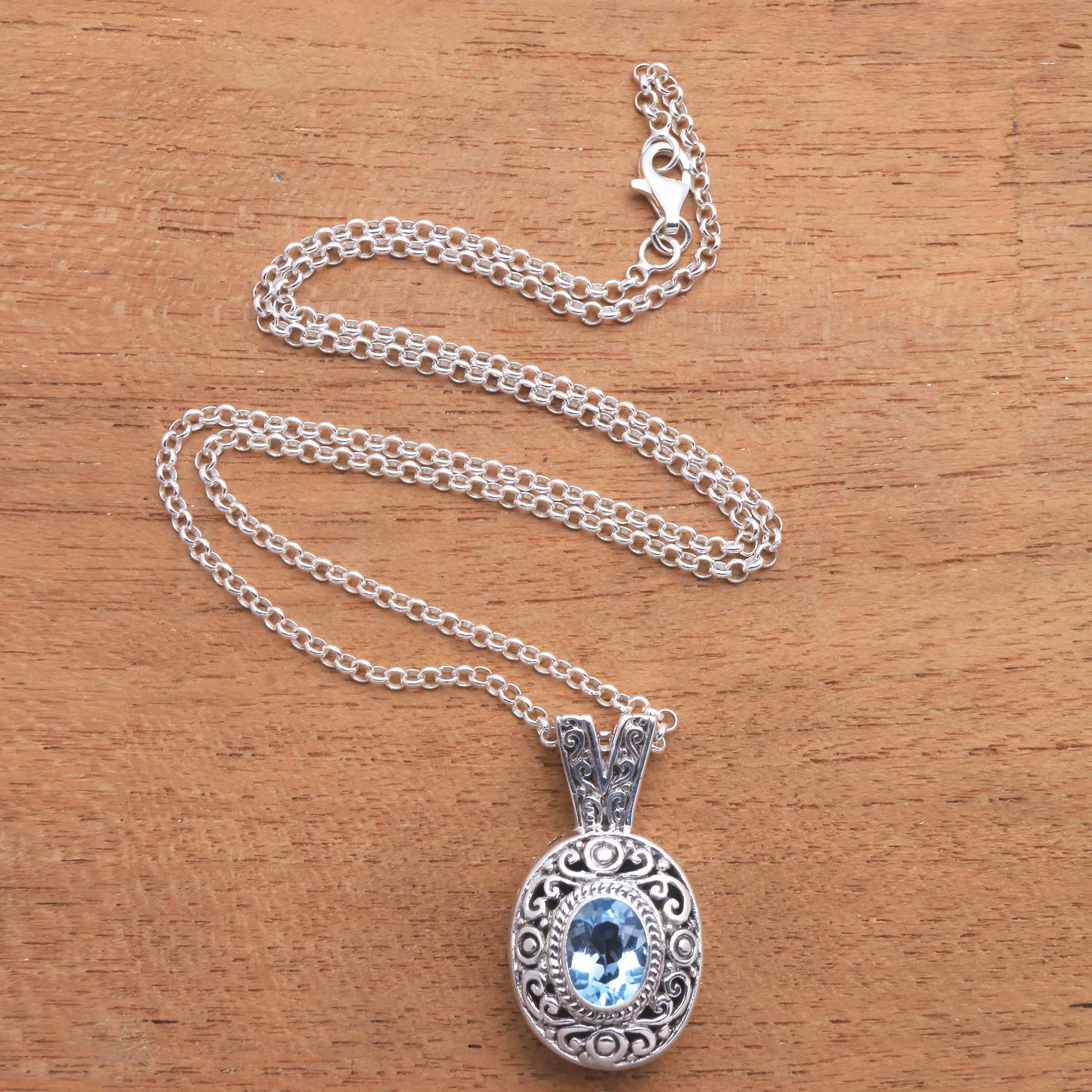 Swirl Pattern Blue Topaz Pendant Necklace from Bali - Angel Eye | NOVICA