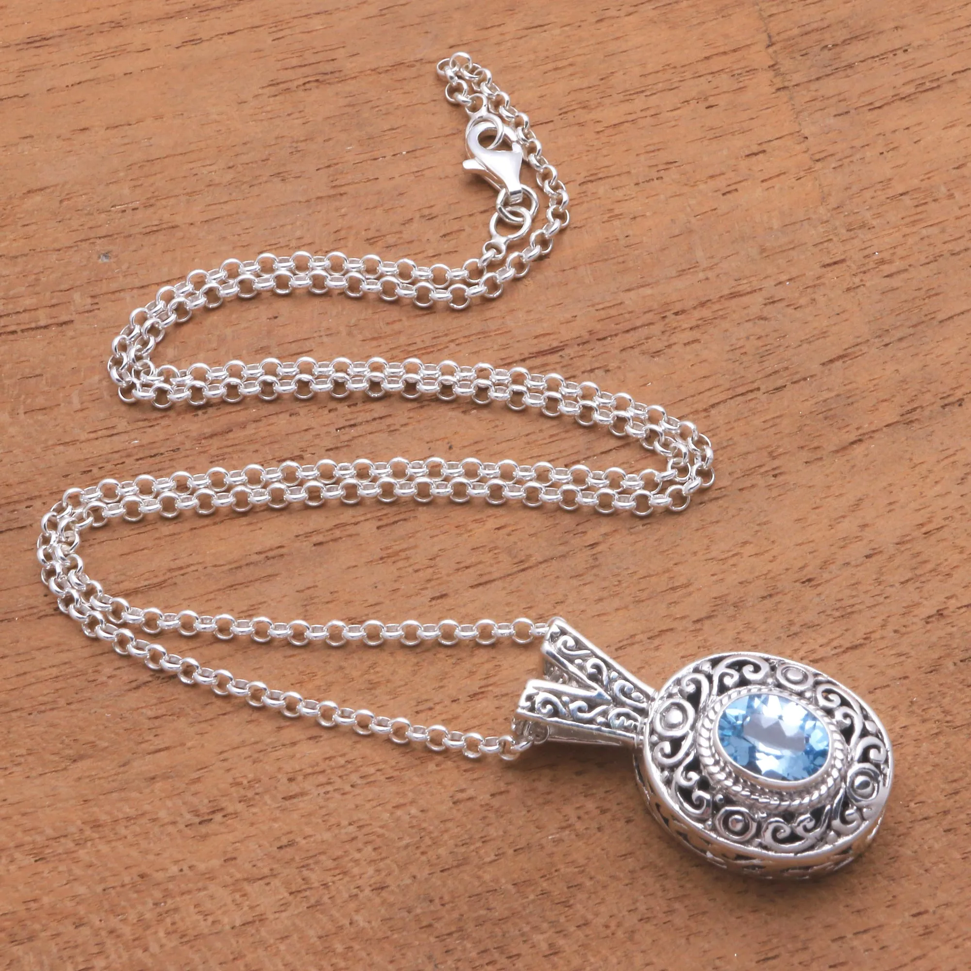 Swirl Pattern Blue Topaz Pendant Necklace from Bali - Angel Eye | NOVICA